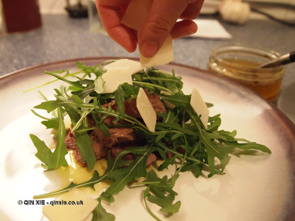 Parmesan over perfect steaks and rocket